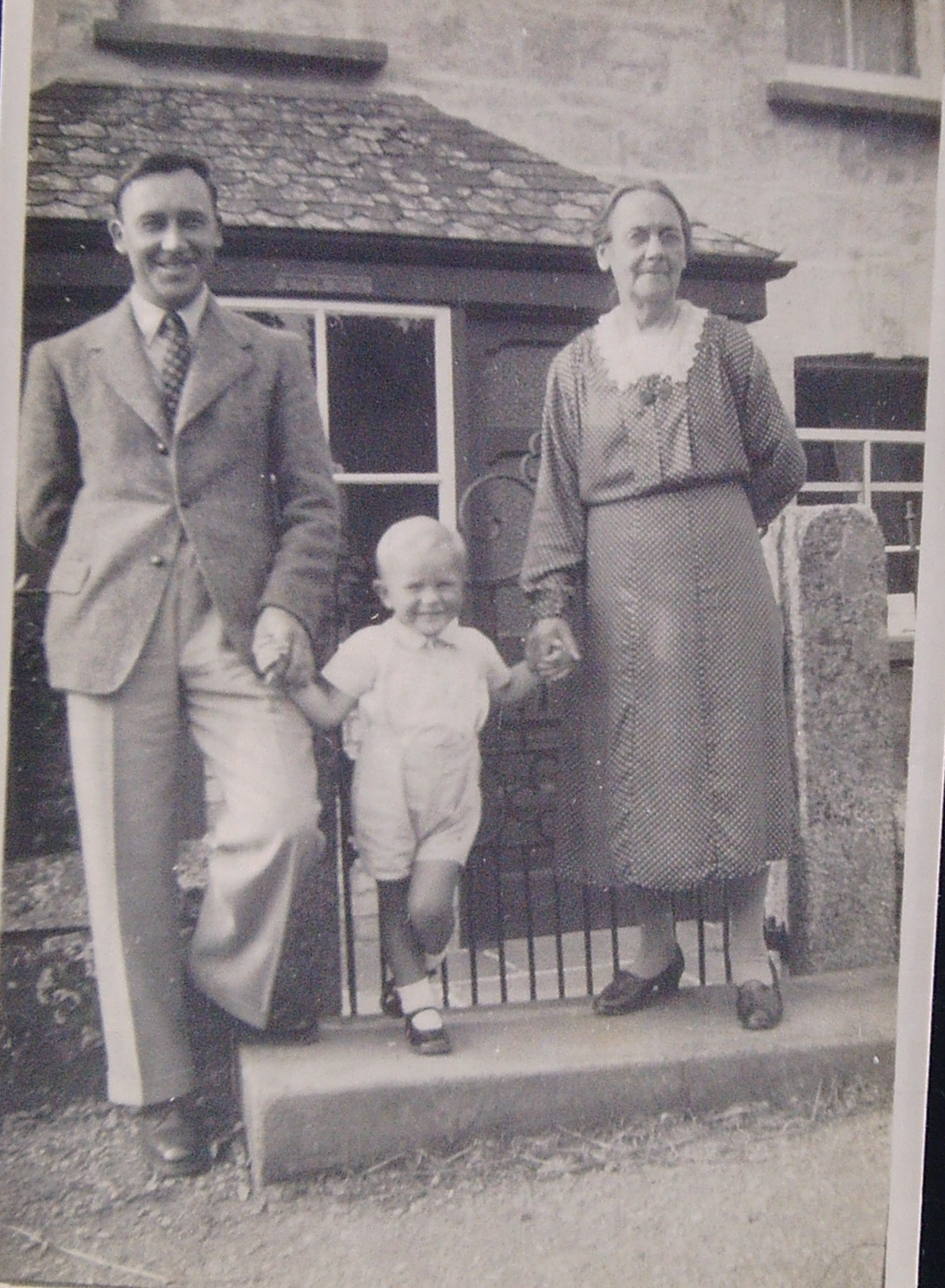 30 Lewis Oaten and his mother Mary (Polly) Oaten outside the house where they both were born, Kitts Hill, St Kew, with his son Brian Oaten.PNG.pdf